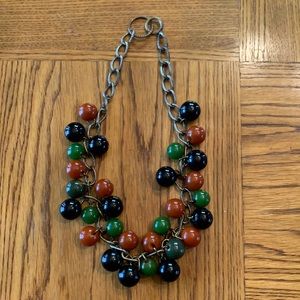 Necklace of Tri Colored Beads. Beads are Black, Green and Rust.